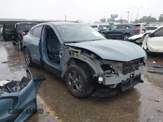 2023 Ford Mustang Mach-E Select z VIN 3FMTK1RM4PMA18023, wystawiony jako IAAI lot #42095837 z przebiegiem 5 814 mil mil oraz . Historia ofert i sprzedaży dostępna na DreamBid. Obrazek 1.