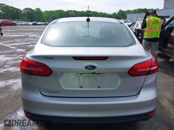 2017 Ford Focus S z VIN 1FADP3E21HL241557, wystawiony jako IAAI lot #42100036 z przebiegiem 106 764 mil mil oraz . Historia ofert i sprzedaży dostępna na DreamBid. Obrazek 16.