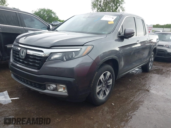 2018 Honda Ridgeline RTL-E with VIN 5FPYK3F74JB012181, listed as a IAAI auction lot 42143197 with 117,520 mi miles and . Bid and sale history available at DreamBid. Image 2.
