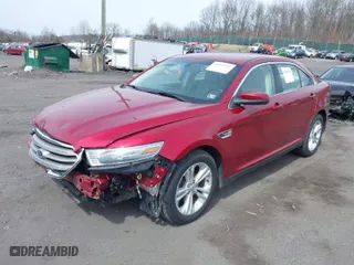 2014 Ford Taurus SEL with VIN 1FAHP2E85EG136900, listed as a IAAI auction lot 41941219 with 123,631 mi miles. Bid and sale history available at carsss.com. Image 2.