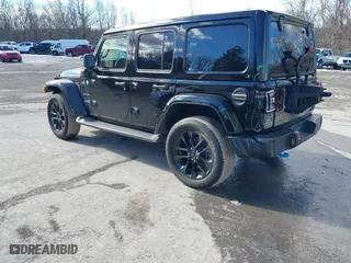 2023 Jeep Wrangler 4xe Sahara with VIN 1C4JJXP62PW613040, listed as a IAAI auction lot 41489171 with 36,818 mi miles. Bid and sale history available at carsss.com. Image 3.