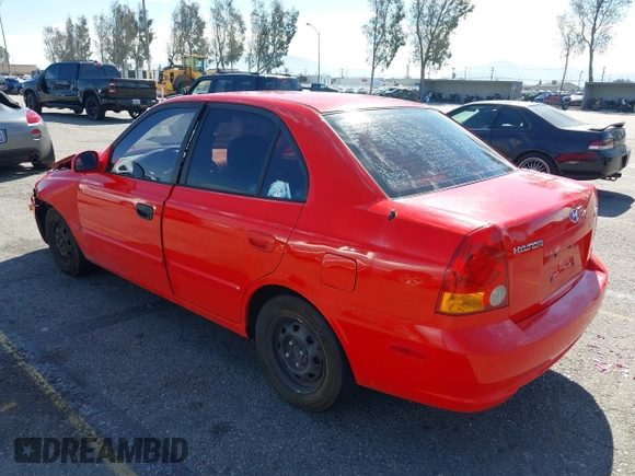 2003 Hyundai Accent GL with VIN KMHCG45C93U487209, listed as a IAAI auction lot 41590636 with 118,811 mi miles. Bid and sale history available at carsss.com. Image 3.