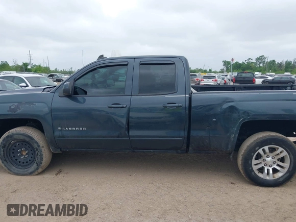 2018 Chevrolet Silverado 1500 LT with VIN 1GCRCREC9JZ105218, listed as a IAAI auction lot 40778682 with 124,621 mi miles and . Bid and sale history available at DreamBid. Image 14.