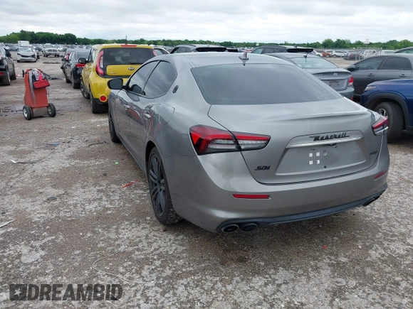 2021 Maserati Ghibli S Q4 with VIN ZAM57YTA8M1368703, listed as a IAAI auction lot 42170551 with 29,969 mi miles and . Bid and sale history available at DreamBid. Image 3.