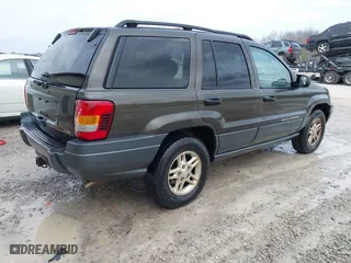 2004 Jeep Grand Cherokee Laredo with VIN 1J4GX48N74C412982, listed as a IAAI auction lot 41496258 with 195,671 mi miles. Bid and sale history available at carsss.com. Image 4.