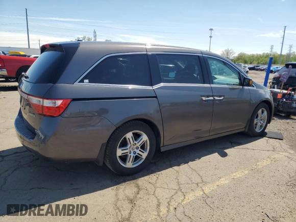 2012 Honda Odyssey Touring with VIN 5FNRL5H90CB093963, listed as a Copart auction lot 55434725 with 202,867 mi miles and Salvage Title. Bid and sale history available at DreamBid. Image 3.
