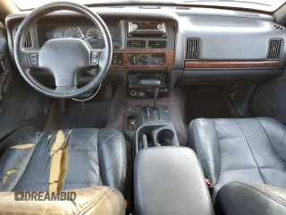 1996 Jeep Grand Cherokee z VIN 1J4FX78S6TC221815, wystawiony jako Copart lot #44000615 z przebiegiem 287 308 mil mil oraz Szkoda całkowita • Salvage title. Historia ofert i sprzedaży dostępna na DreamBid. Obrazek 8.