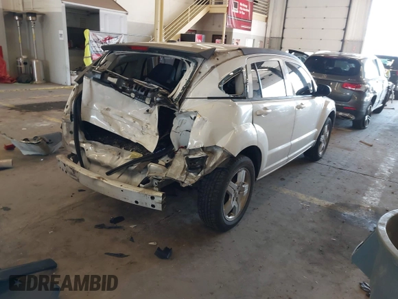 2009 Dodge Caliber SXT with VIN 1B3HB48A89D116734, listed as a IAAI auction lot 41959281 with 209,136 mi miles and . Bid and sale history available at DreamBid. Image 4.