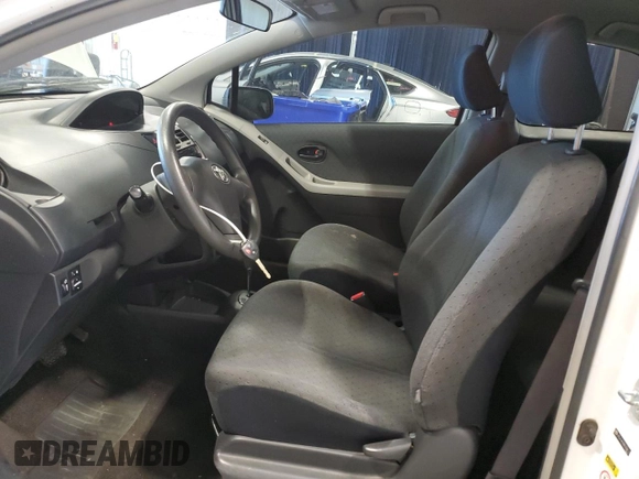 2011 Toyota Yaris with VIN JTDJT4K30B5334173, listed as a Copart auction lot 87031624 with 179,280 mi miles and Salvage Title. Bid and sale history available at carsss.com. Image 7.
