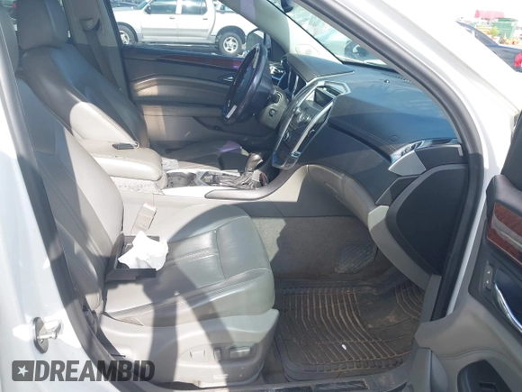2012 Cadillac SRX Performance Collection with VIN 3GYFNBE34CS659748, listed as a IAAI auction lot 42693814 with 216,854 mi miles and . Bid and sale history available at DreamBid. Image 5.