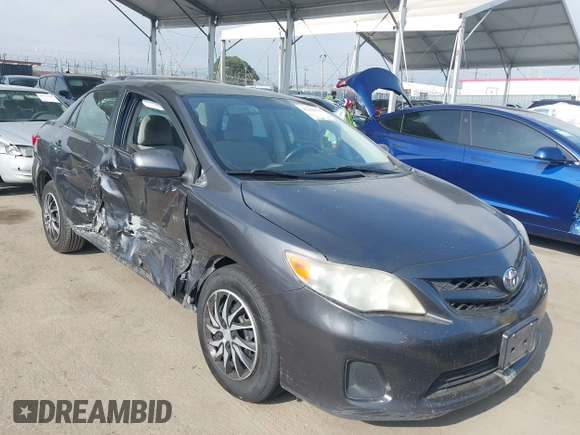 2011 Toyota Corolla L with VIN JTDBU4EE3BJ090749, listed as a IAAI auction lot 42106633 with 209,824 mi miles. Bid and sale history available at carsss.com. Image 1.