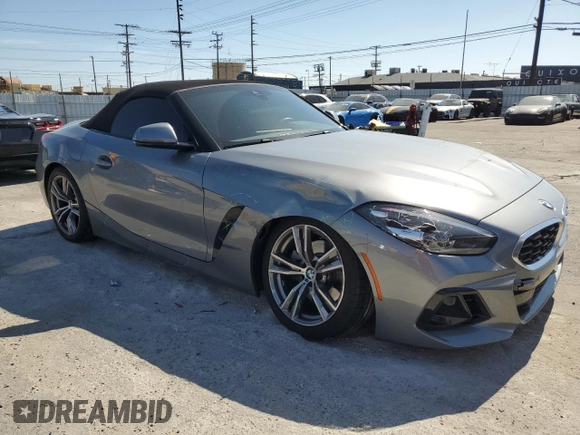 2024 BMW Z4 sDrive30i with VIN WBAHF3C06RWY36286, listed as a Copart auction lot 50296565 with 9,898 mi miles and Salvage title. Bid and sale history available at DreamBid. Image 4.