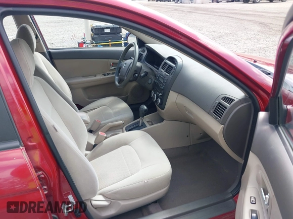2009 Kia Spectra EX with VIN KNAFE222195661572, listed as a IAAI auction lot 42148750 with 137,773 mi miles. Bid and sale history available at carsss.com. Image 5.