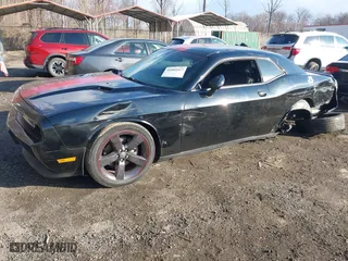 2013 Dodge Challenger SXT with VIN 2C3CDYAG5DH520017, listed as a IAAI auction lot 41882517 with 128,854 mi miles. Bid and sale history available at carsss.com. Image 2.