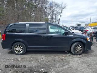 2019 Dodge Grand Caravan SXT with VIN 2C4RDGCG9KR804867, listed as a IAAI auction lot 42032311 with 157,351 mi miles and . Bid and sale history available at DreamBid. Image 13.