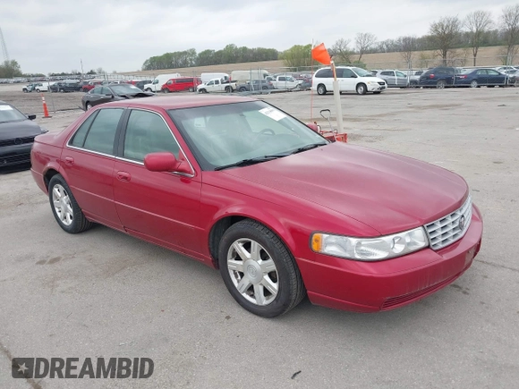 2001 Cadillac Seville z VIN 1G8KS54Y91U227846, wystawiony jako IAAI lot #42134095 z przebiegiem 216 766 mil mil oraz . Historia ofert i sprzedaży dostępna na DreamBid. Obrazek 1.