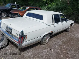 1991 Cadillac Brougham z VIN 1G6DW54E5MR723477, wystawiony jako IAAI lot #42535123 z przebiegiem 300 768 mil mil oraz . Historia ofert i sprzedaży dostępna na DreamBid. Obrazek 4.