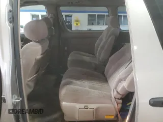 2000 Toyota Sienna LE z VIN 4T3ZF13C6YU210501, wystawiony jako Copart lot #56510955 z przebiegiem 253 950 mil mil oraz Szkody całkowita. Historia ofert i sprzedaży dostępna na DreamBid. Obrazek 11.