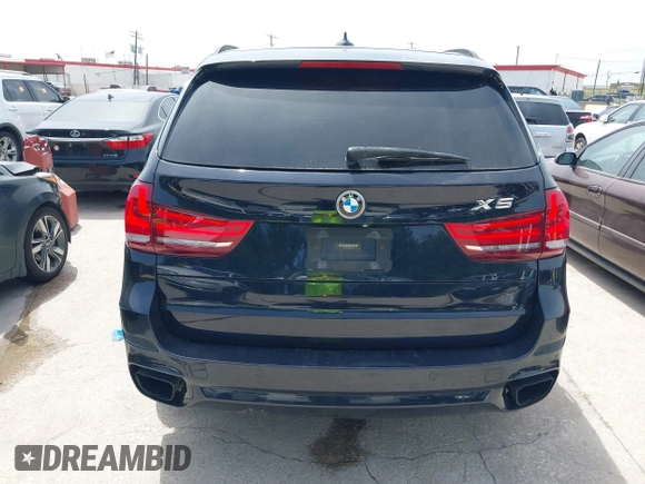 2014 BMW X5 xDrive50i with VIN 5UXKR6C55E0C03743, listed as a IAAI auction lot 42268302 with 118,892 mi miles and . Bid and sale history available at DreamBid. Image 16.