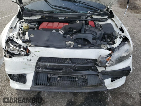 2014 Mitsubishi Lancer Evolution GSR z VIN JA32W8FV2EU019253, wystawiony jako Copart lot #86615084 z przebiegiem 104 894 mil mil oraz Szkody całkowita. Historia ofert i sprzedaży dostępna na DreamBid. Obrazek 11.
