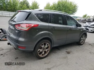 2015 Ford Escape Titanium with VIN 1FMCU9J93FUA67563, listed as a Copart auction lot 61770085 with 134,201 mi miles and Salvage title. Bid and sale history available at DreamBid. Image 3.