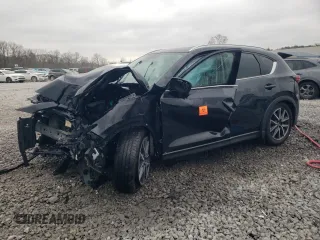 2018 Mazda CX-5 Grand Touring z VIN JM3KFBDM0J0403095, wystawiony jako Copart lot #48594495 z przebiegiem Nie podano mil oraz Szkoda całkowita • Salvage title. Historia ofert i sprzedaży dostępna na DreamBid. Obrazek 1.