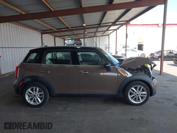 2012 MINI Countryman with VIN WMWZB3C51CWM04563, listed as a IAAI auction lot 42564564 with 95,760 mi miles and . Bid and sale history available at DreamBid. Image 13.