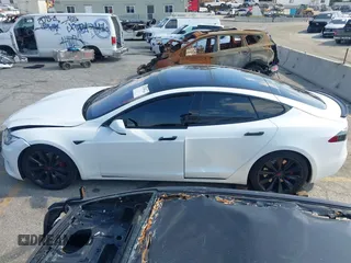 2016 Tesla Model S 90D with VIN 5YJSA1E27GF153525, listed as a IAAI auction lot 41539221 with 145,771 mi miles and . Bid and sale history available at DreamBid. Image 14.