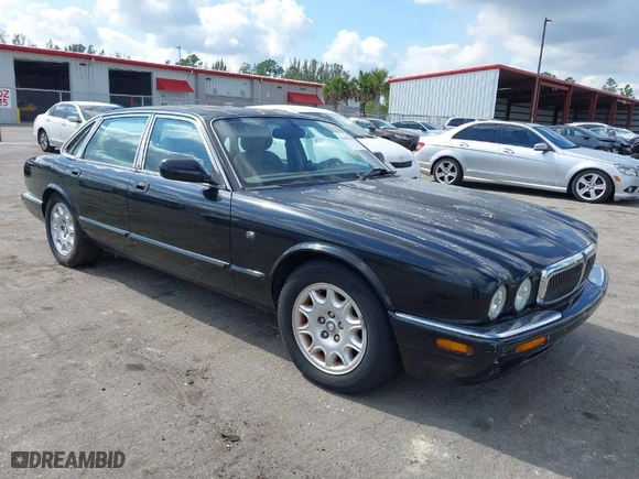 2000 Jaguar XJ with VIN SAJDA14C1YLF04600, listed as a IAAI auction lot 41496106 with 105,000 mi miles. Bid and sale history available at carsss.com. Image 1.