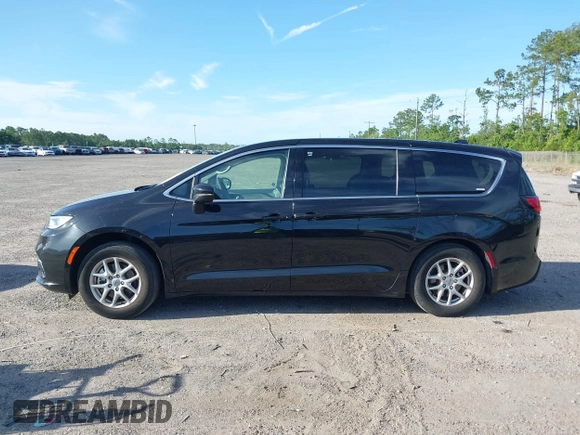 2023 Chrysler Pacifica Touring L with VIN 2C4RC1BG1PR606566, listed as a IAAI auction lot 42615498 with 42,980 mi miles and . Bid and sale history available at DreamBid. Image 14.