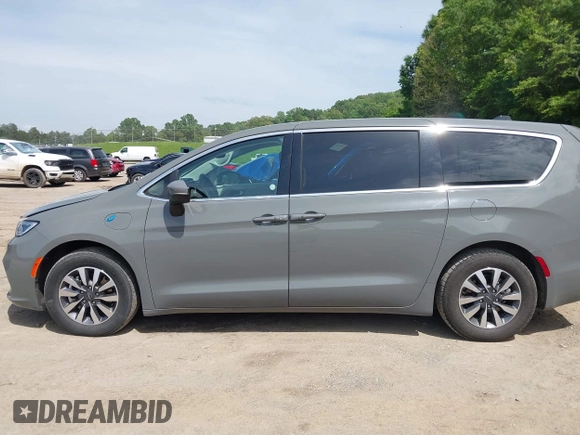 2023 Chrysler Pacifica Hybrid Touring L with VIN 2C4RC1L73PR522988, listed as a IAAI auction lot 42280263 with 54,939 mi miles and . Bid and sale history available at DreamBid. Image 14.