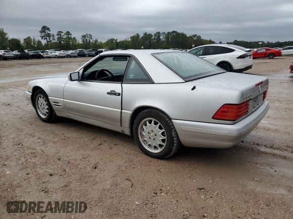 1997 Mercedes-Benz SL 500 with VIN WDBFA63F4VF148651, listed as a Copart auction lot 75893884 with 96,697 mi miles and Clean title. Bid and sale history available at DreamBid. Image 2.
