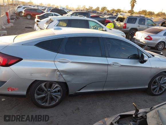 2018 Honda Clarity with VIN JHMZC5F15JC018312, listed as a IAAI auction lot 41354648 with 97,035 mi miles and . Bid and sale history available at DreamBid. Image 13.