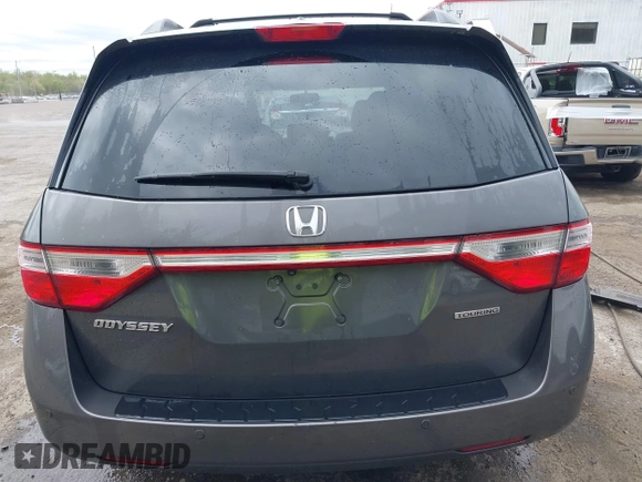 2013 Honda Odyssey Touring with VIN 5FNRL5H94DB013310, listed as a IAAI auction lot 42079565 with 128,622 mi miles and . Bid and sale history available at carsss.com. Image 16.