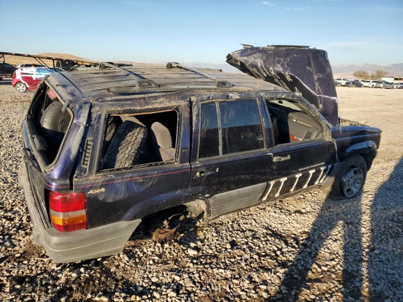 1997 Jeep Grand Cherokee Laredo with VIN 1J4GZ58Y0VC547880, listed as a Copart auction lot 79866684 with 0 mi miles and Salvage Title. Bid and sale history available at carsss.com. Image 3.