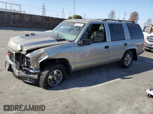 1999 GMC Yukon with VIN 1GKEC13R9XJ704929, listed as a Copart auction lot 89097295 with 87,478 mi miles and Salvage Title. Bid and sale history available at carsss.com. Image 1.
