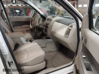 2009 Mercury Mariner Premier with VIN 4M2CU87779KJ14155, listed as a IAAI auction lot 41520138 with 175,980 mi miles. Bid and sale history available at carsss.com. Image 5.