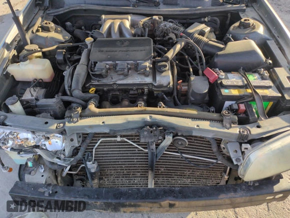2001 Toyota Camry LE z VIN JT2BF22K810291438, wystawiony jako Copart lot #54261565 z przebiegiem 174 101 mil mil oraz Szkoda całkowita • Salvage title. Historia ofert i sprzedaży dostępna na DreamBid. Obrazek 11.