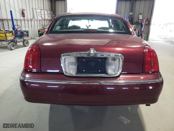 1999 Lincoln Town Car Signature with VIN 1LNHM82W6XY616896, listed as a Copart auction lot 48355275 with 168,128 mi miles and Salvage Title. Bid and sale history available at carsss.com. Image 6.