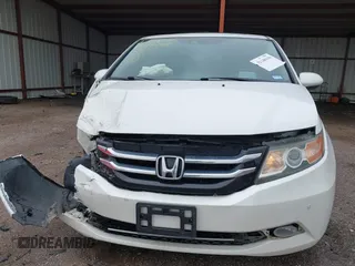 2014 Honda Odyssey Touring with VIN 5FNRL5H95EB059729, listed as a IAAI auction lot 42148110 with 135,304 mi miles and . Bid and sale history available at DreamBid. Image 6.