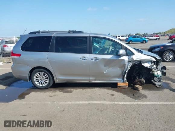 2011 Toyota Sienna XLE AAS with VIN 5TDYK3DC8BS156127, listed as a IAAI auction lot 42103980 with 129,851 mi miles. Bid and sale history available at carsss.com. Image 14.
