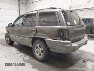 1999 Jeep Grand Cherokee Laredo with VIN 1J4GW58SXXC584734, listed as a IAAI auction lot 41902224 with 209,180 mi miles and . Bid and sale history available at DreamBid. Image 3.