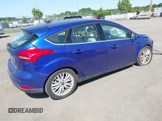 2015 Ford Focus Titanium z VIN 1FADP3N25FL291844, wystawiony jako IAAI lot #42383067 z przebiegiem 82 545 mil mil oraz . Historia ofert i sprzedaży dostępna na DreamBid. Obrazek 4.