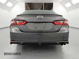 2022 Toyota Camry SE z VIN 4T1G11AK5NU686954, wystawiony jako Copart lot #59572575 z przebiegiem 115 123 mil mil oraz Czysty tytuł • Clean title. Historia ofert i sprzedaży dostępna na DreamBid. Obrazek 6.