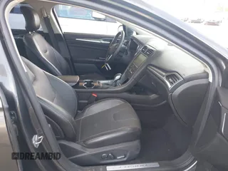 2016 Ford Fusion Titanium with VIN 3FA6P0SU9GR134575, listed as a IAAI auction lot 42338427 with 123,765 mi miles and . Bid and sale history available at DreamBid. Image 5.
