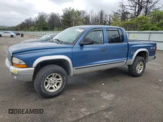 2004 Dodge Dakota SLT z VIN 1D7HG48K04S739865, wystawiony jako Copart lot #57867265 z przebiegiem 214 698 mil mil oraz Tytuł czysty. Historia ofert i sprzedaży dostępna na DreamBid. Obrazek 1.