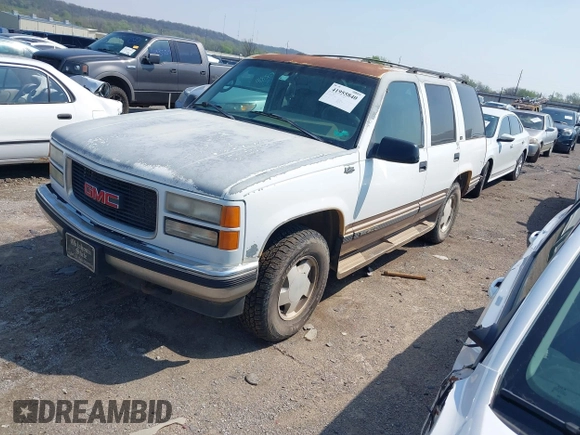 1996 GMC Yukon with VIN 1GKEK13R2TJ746811, listed as a IAAI auction lot 41955840 with 2,242,108 mi miles. Bid and sale history available at carsss.com. Image 2.