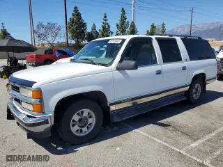 1999 Chevrolet Suburban with VIN 3GNEC16R0XG164600, listed as a Copart auction lot 49516445 with 105,747 mi miles and Salvage Title. Bid and sale history available at carsss.com. Image 1.