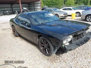 2014 Dodge Challenger R/T Plus z VIN 2C3CDYBT1EH201887, wystawiony jako IAAI lot #42225211 z przebiegiem 278 574 mil mil oraz . Historia ofert i sprzedaży dostępna na DreamBid. Obrazek 1.