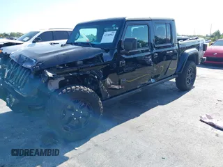 2021 Jeep Gladiator Willys with VIN 1C6HJTAGXML613431, listed as a IAAI auction lot 42180502 with 64,572 mi miles and . Bid and sale history available at DreamBid. Image 2.